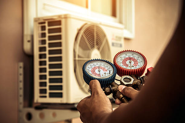 Professional Heat Pump Repair technician working in Elizabeth, IN